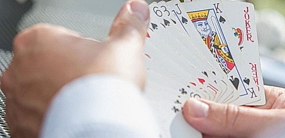Man holding poker cards